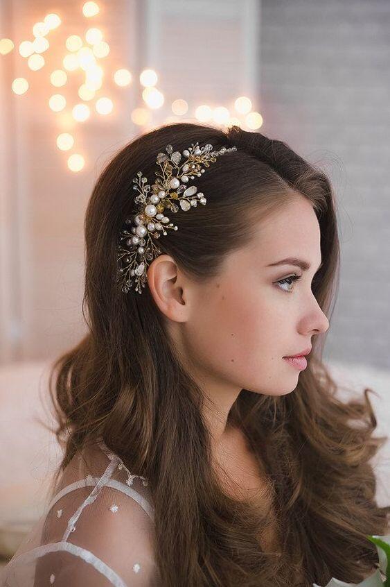  - This is a brushed out version of the old fashion hollywood waves, which was very popular for the 2018 wedding season. With 2019, we have seen the trends shift all together to be softer and more romantic. I think this blown out curled look is gorgeous for a bride that doesn’t mind having her hair down. Keep in mind, to achieve this look, extensions might be necessary for fullness and desired length!