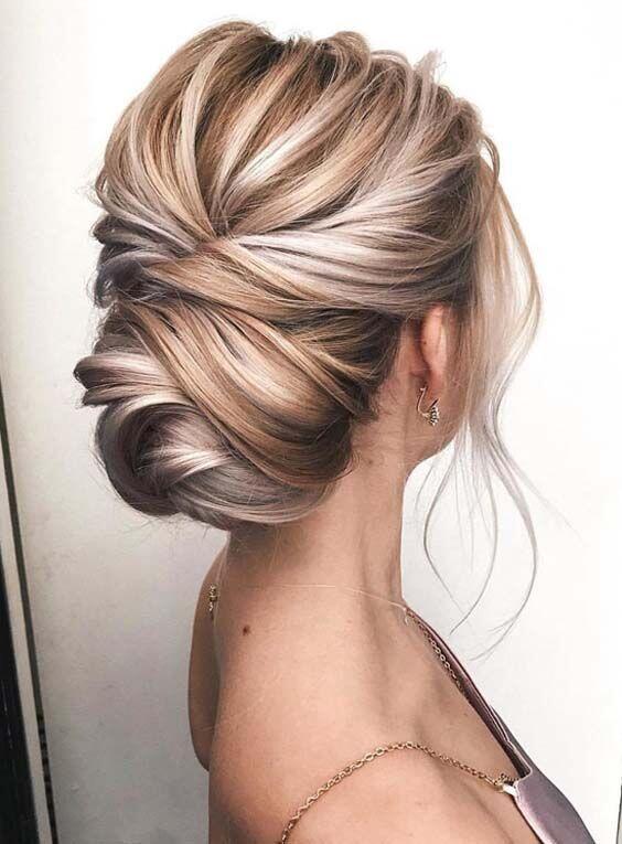  - I have been obsessed with these clean, yet textured upstyle’s. A modern twist on the more traditional structured updo, this style is perfect for a simple bride who wants to show off the dimension of her hair tones. This do can be a great one for brides with shorter hair. If necessary, get your stylist to add a hair donut to make the bun appear larger!